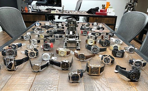 luxury watches spread out on a table