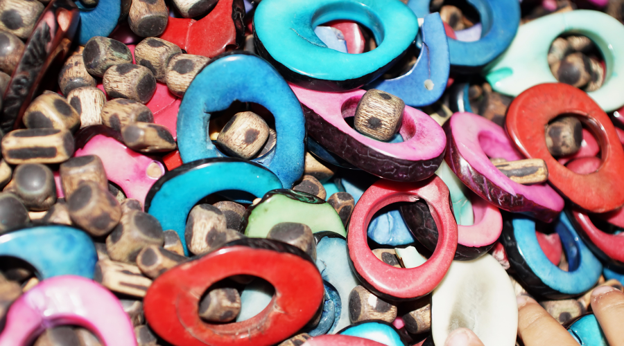 colorful slices of tagua nuts, ready to be made into jewelry