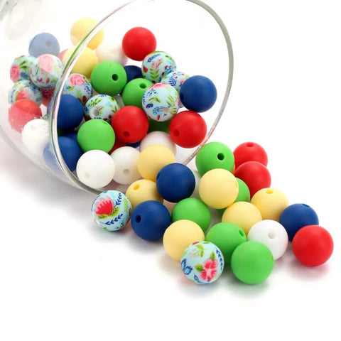 A colorful assortment of child-friendly beads and jewelry-making tools, laid out on a crafting table, ready for a fun project