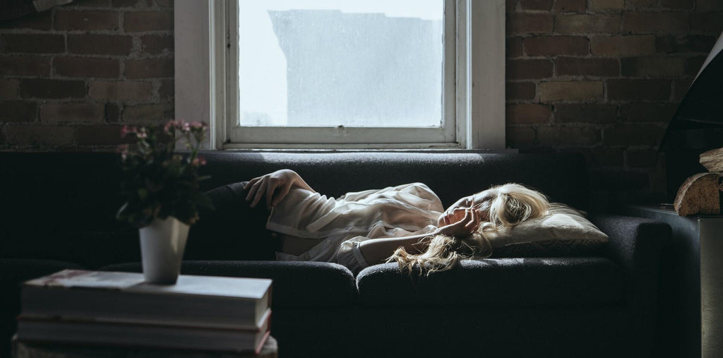 A woman napping on the sofa