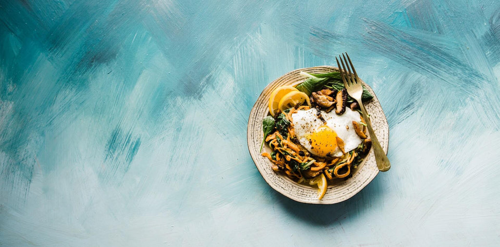 breakfast pasts with fried egg and greens