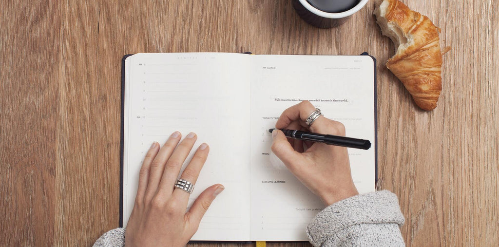 A woman writing down her personal strategic plan