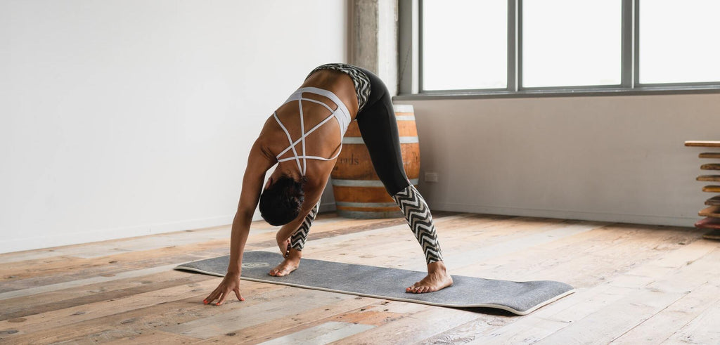 woman stretching and exercising at home to increase her stamina