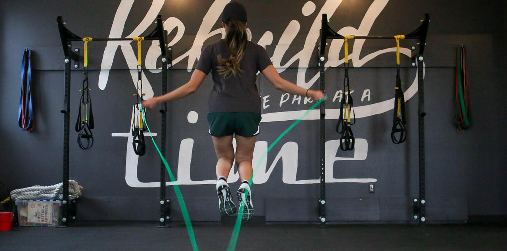 A woman skipping rope in the gym