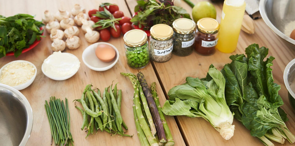 green vegetable on brown table