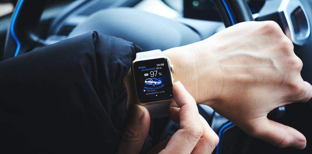 a man is checking his smart watch