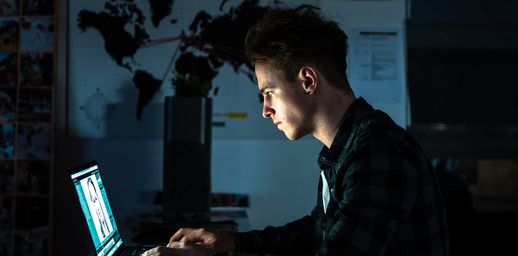 A man pulling an all-nighter to cope with all tasks