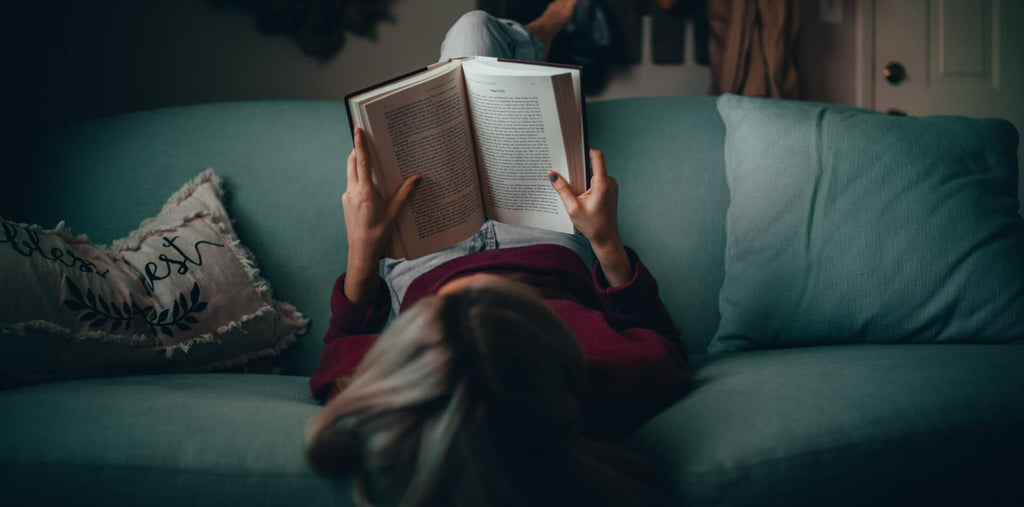 A woman reading in her free time to become more productive
