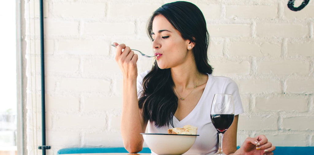 A woman enjoying her balanced meal