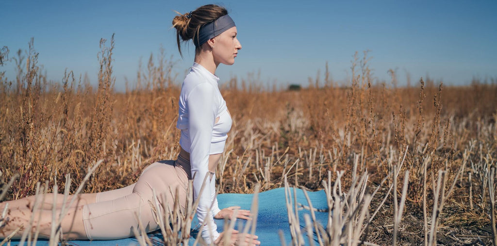 Woman practicing yoga outside