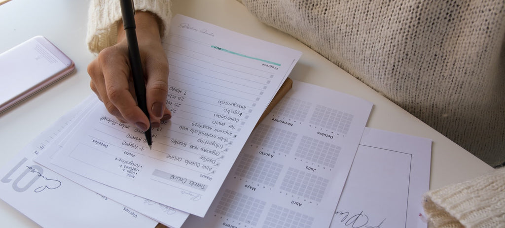 A woman planning her day on the sheet of paper