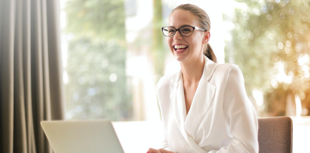 An energized woman at work after taking supplements