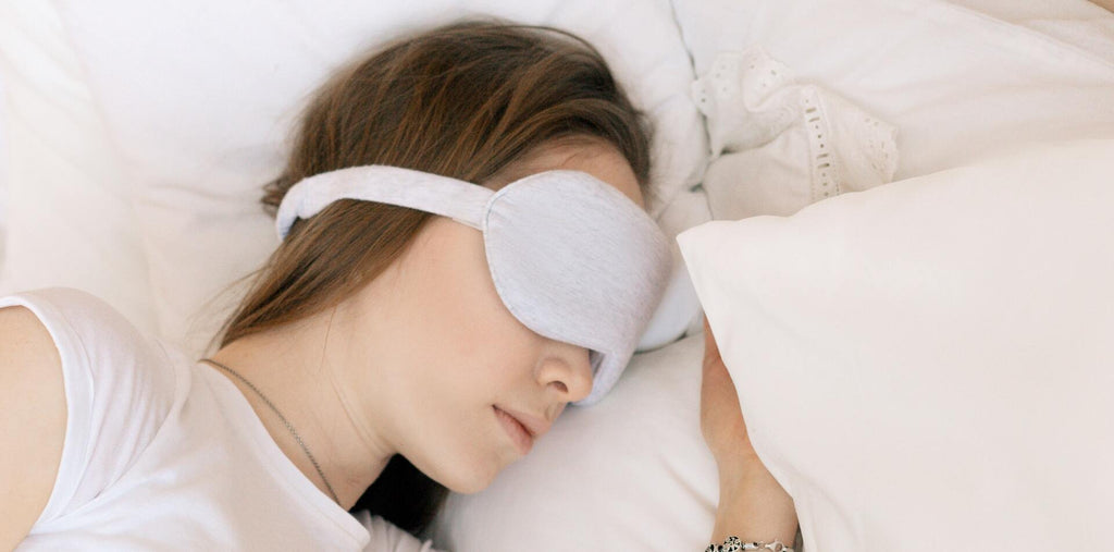 A woman sleeping tight after taking melatonin supplements