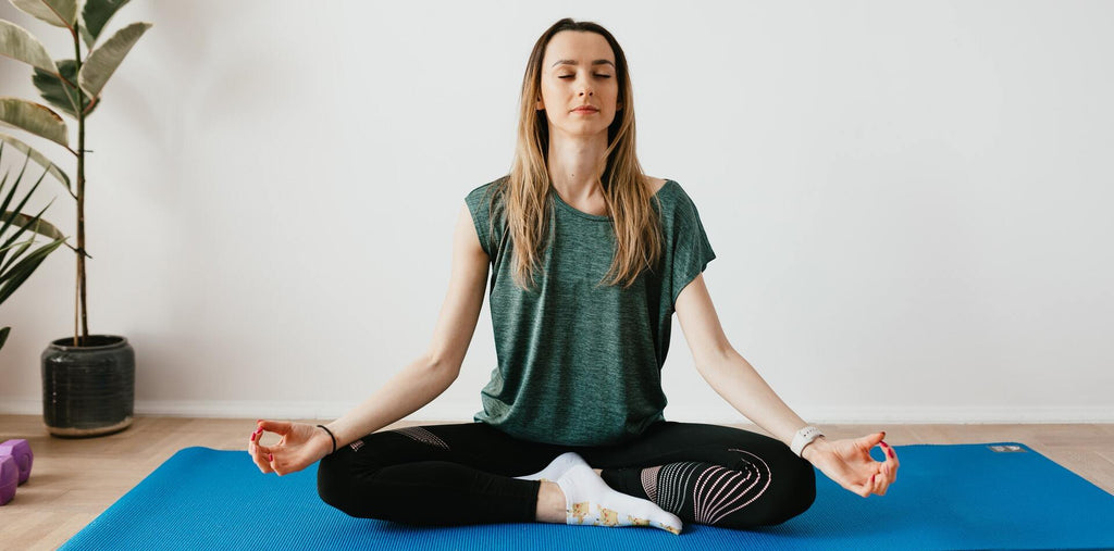 peaceful  lady sitting in yoga pose