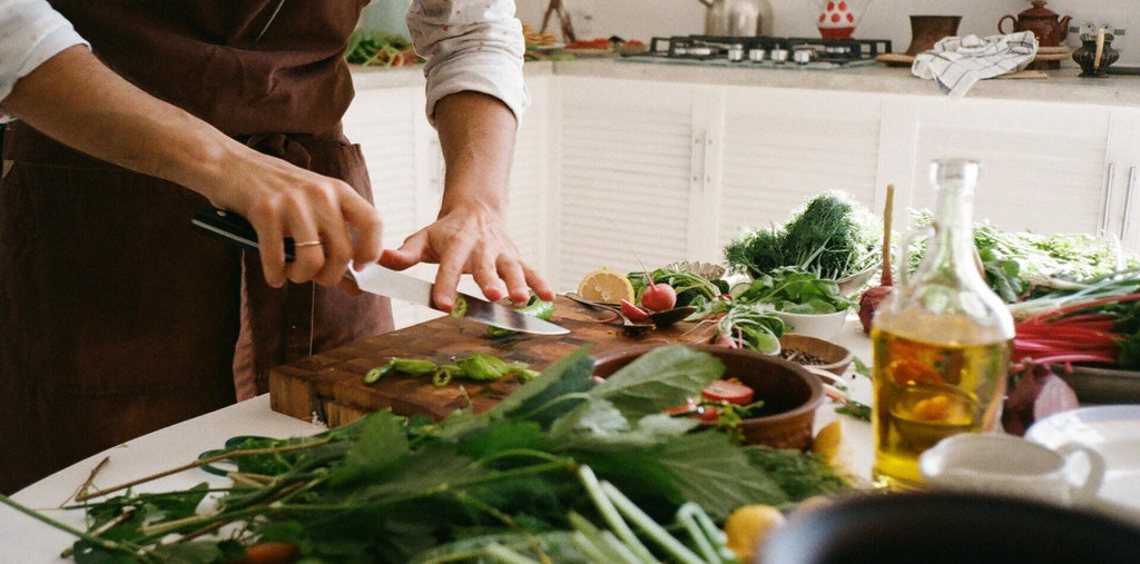 man cooks a salad