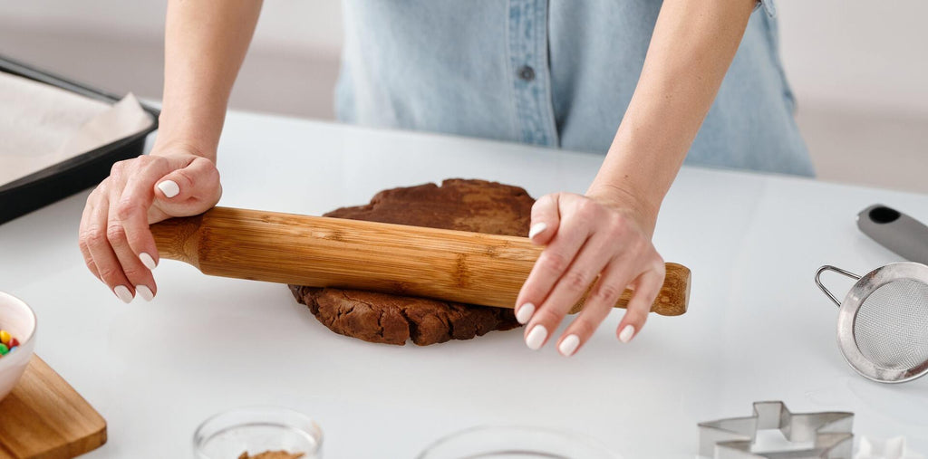 person-flattening-a-chocolate-dough-with-rolling-pin