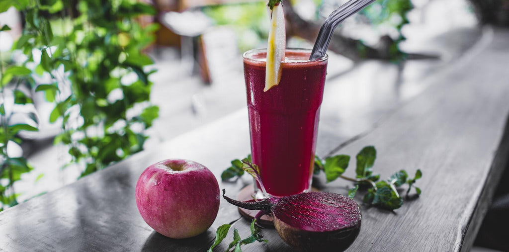 a glass of beetroot juice on the table