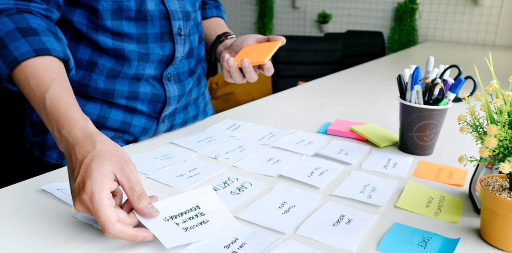 person holding white printer paper