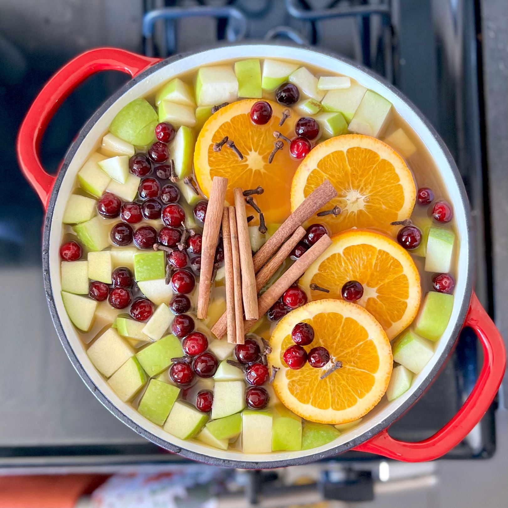 Mulled apple cider on stove