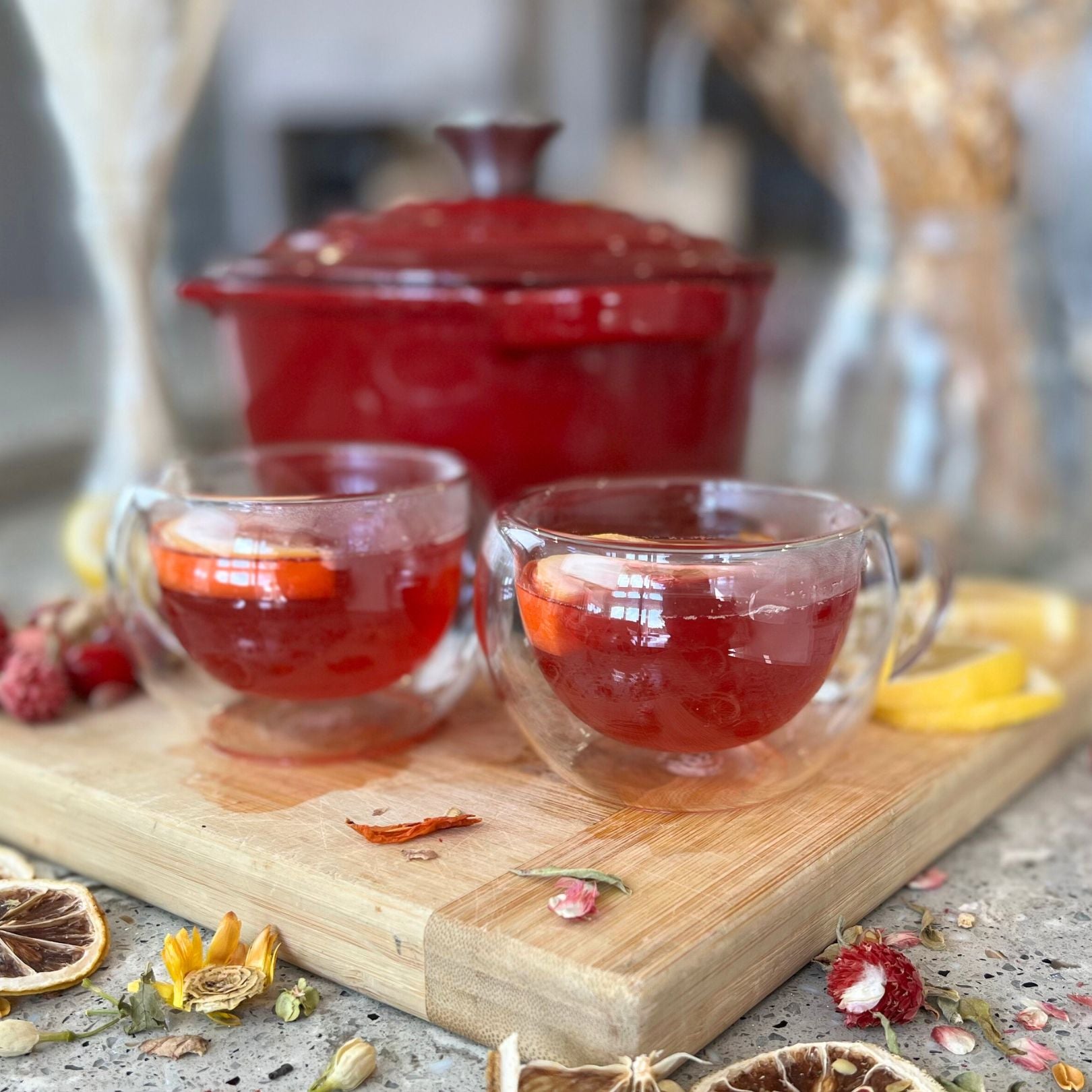 Cranberry Mango Tea in front of Cabernet red Saucepan