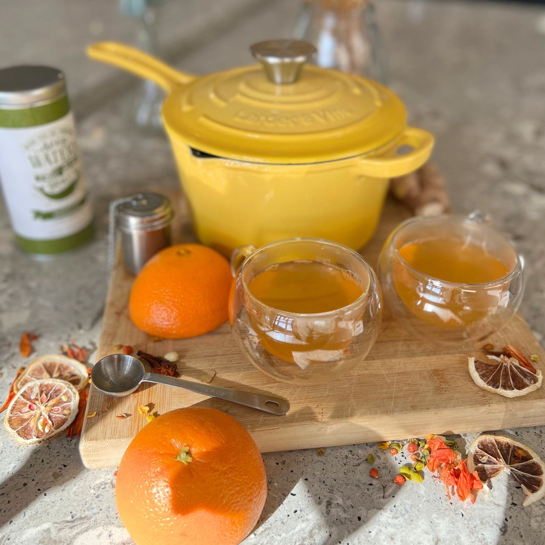Orange Ginger Tea in front of Limoncello yellow Saucepan