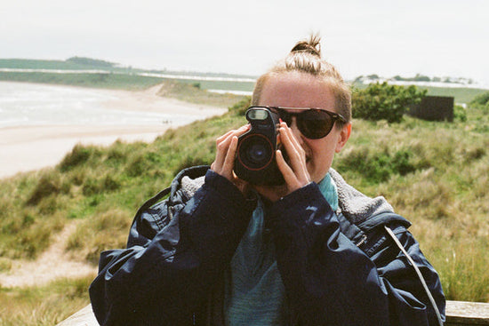 Person holding half-frame