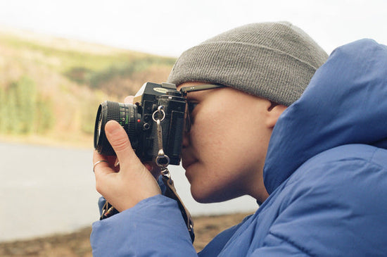 Person holding the Canon A-1 taken with the Canon AV-1 - best 35mm film SLRs for beginners