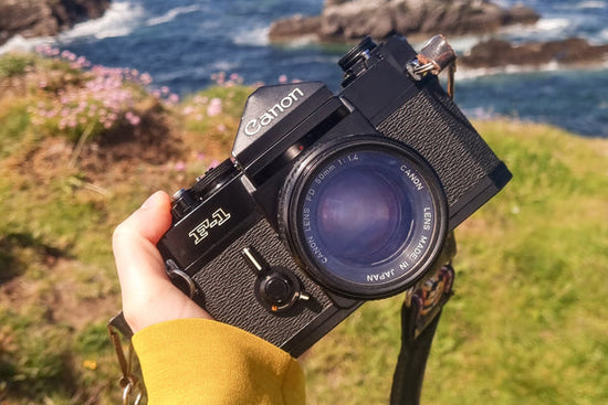 Canon F-1 35mm SLR camera in front of the Scottish ocean