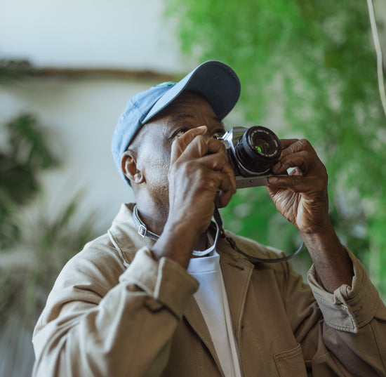 Person holding 35mm film camera