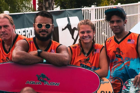 team aquaflow, aquaflowboards sitting on a flowrider surf simulator in orlando florida. flowtour stop at solara resort. 