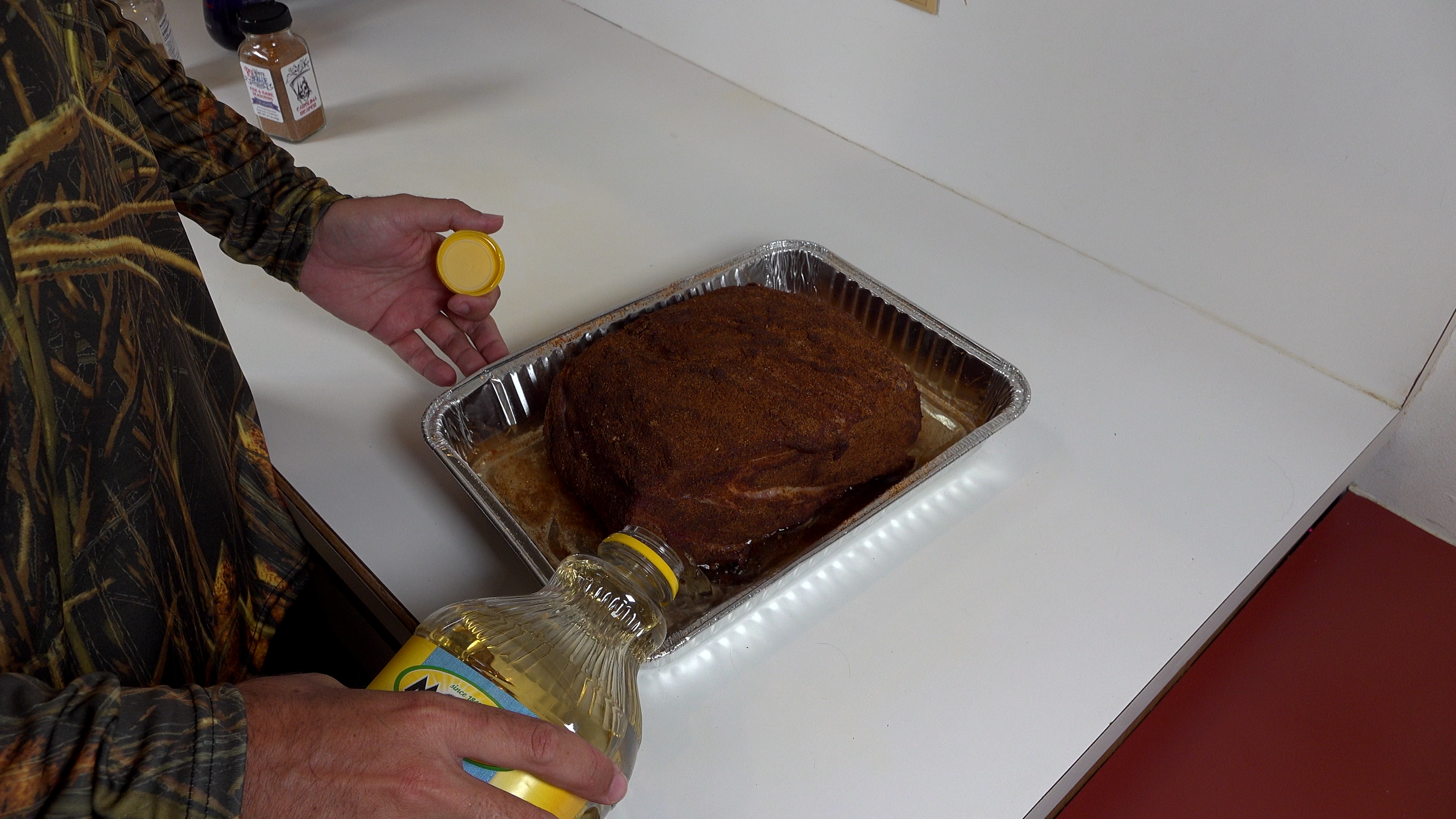 adding apple juice to pulled pork