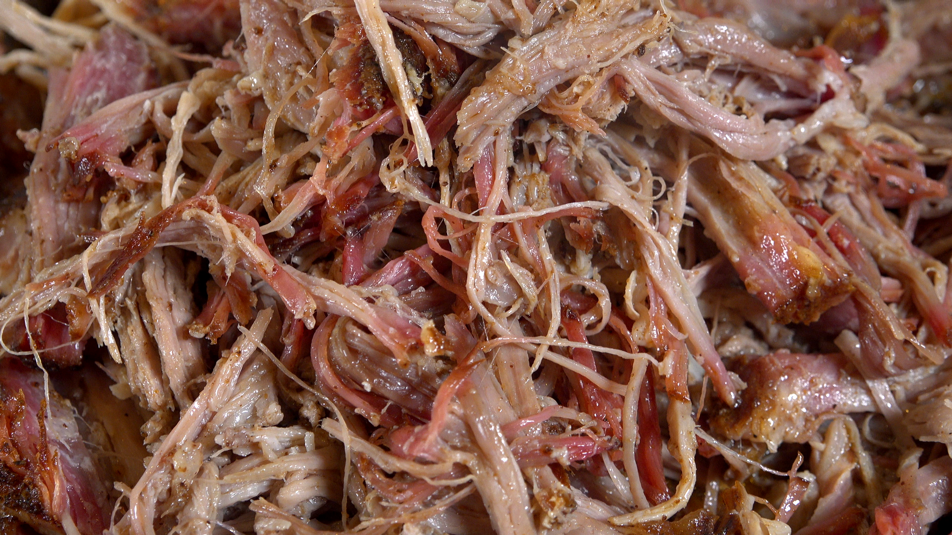 pile of pulled pork from boston butt sweet heat reaper seasoning fish and wild game