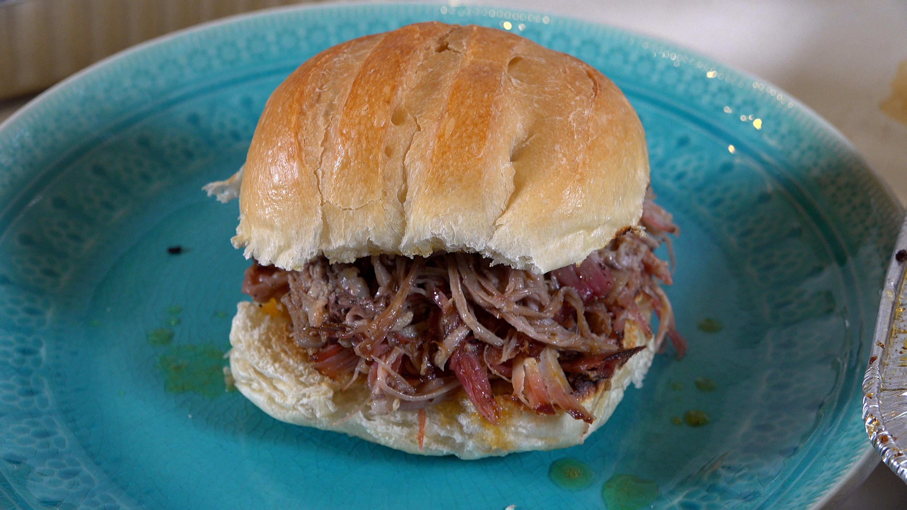 the perfect pulled pork sandwich made with sweet heat and the reaper fish and wild game seasoning