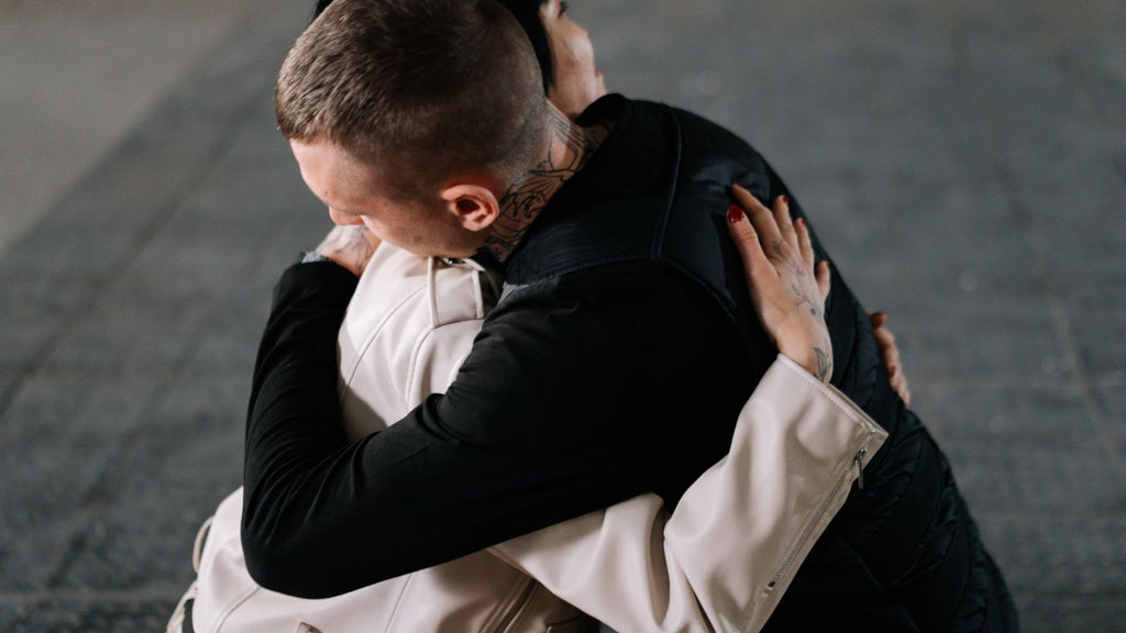 man and woman embracing in a hug