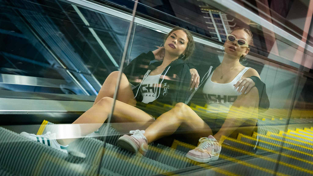 Ocho Promo models on an escalator at Champs trade show in Las Vegas