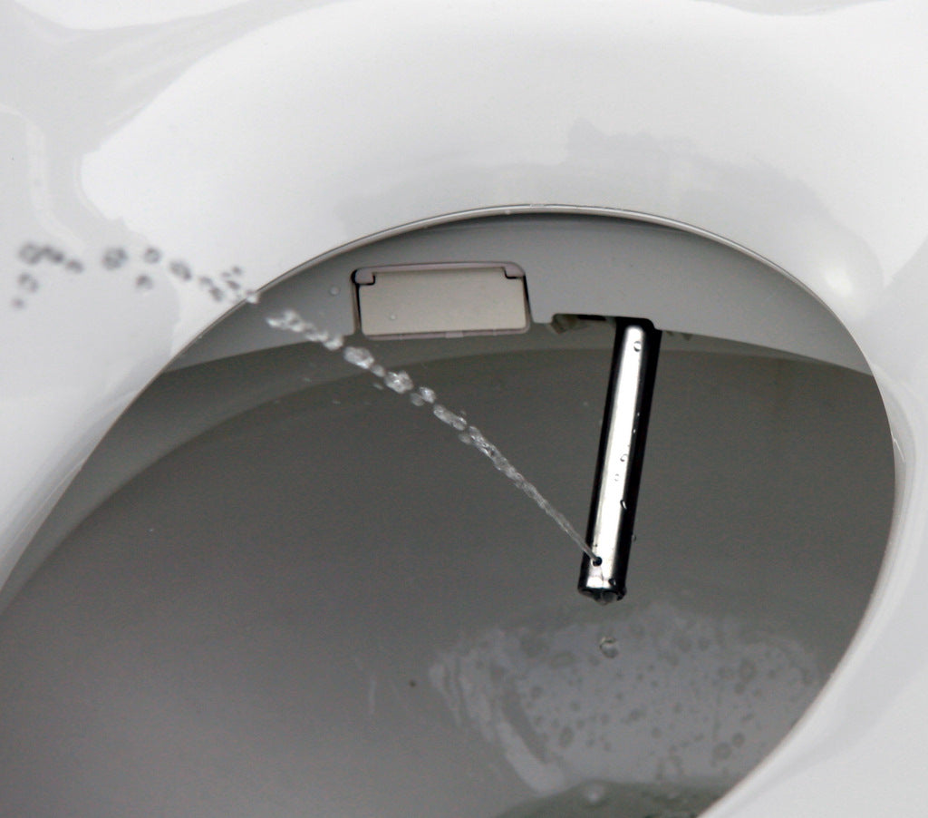 close up of a bidet's nozzle spraying water