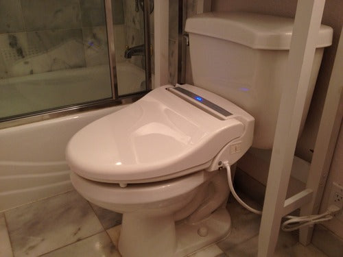Bidet installed on a toilet 