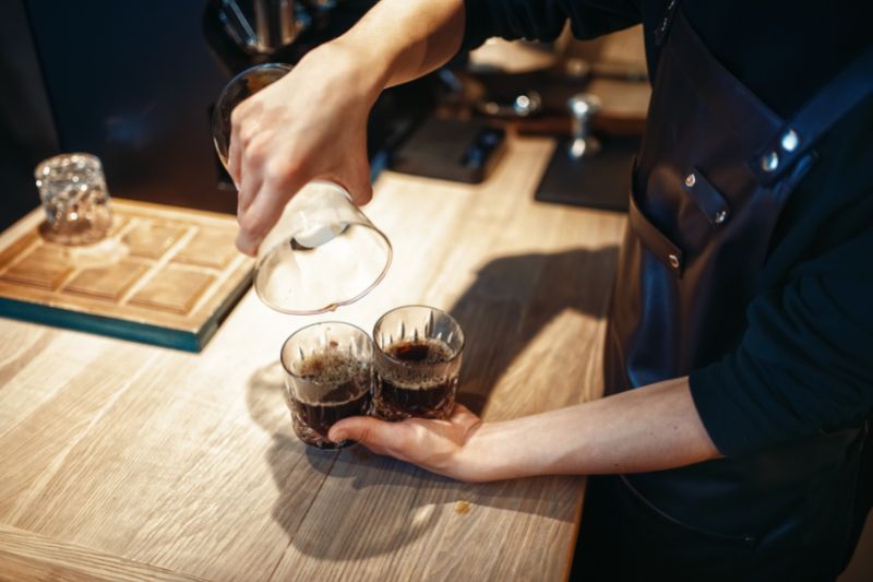 Pouring black coffee