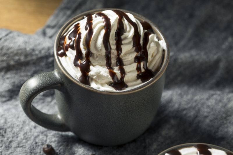 mocha coffee with whipped cream and chocolate drizzle