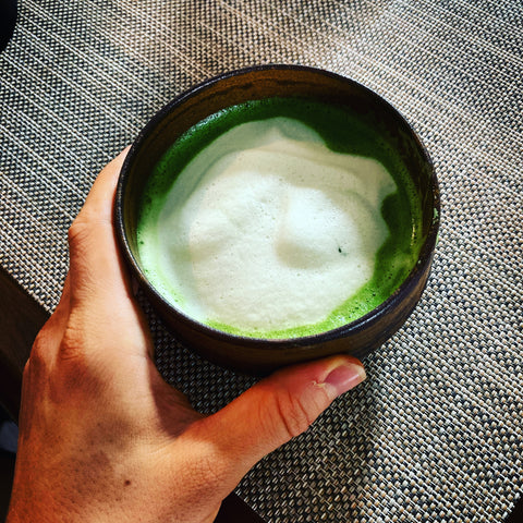 chasen with frothy milk to make a matcha latte, matcha milk tea