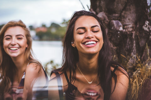 two girls smiling and laughing