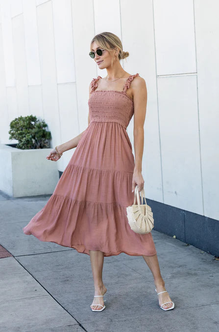 model wearing a pink dress and sandals