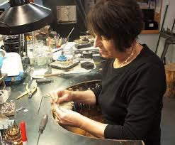 Barbara Heinrich working in her jewelry studio