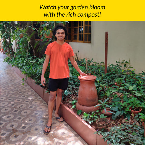 Composting Champion proudly stands with his Prithvi Khamba Row composter in the garden