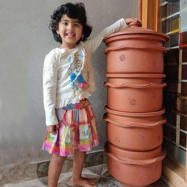 child in front of Daily Dump home composter