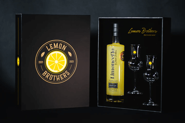 Lemon Brothers’ limited edition gift box containing a bottle of Limonceflo and two branded crystal glasses with a dark background.