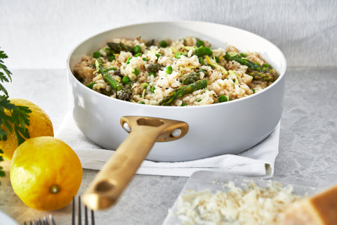 Vegetable Risotto made in a GreenPan Reserve Dove Gray Saute Pan and sitting on a marble countertop.