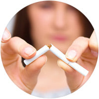 Woman breaking cigarette in half