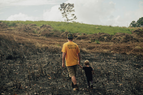 Wesley and Daddy surveying our leased property burned in June 4th brush fire.