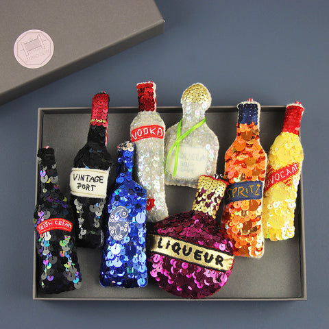 Kate Gwilliam bottles sequinned decorations